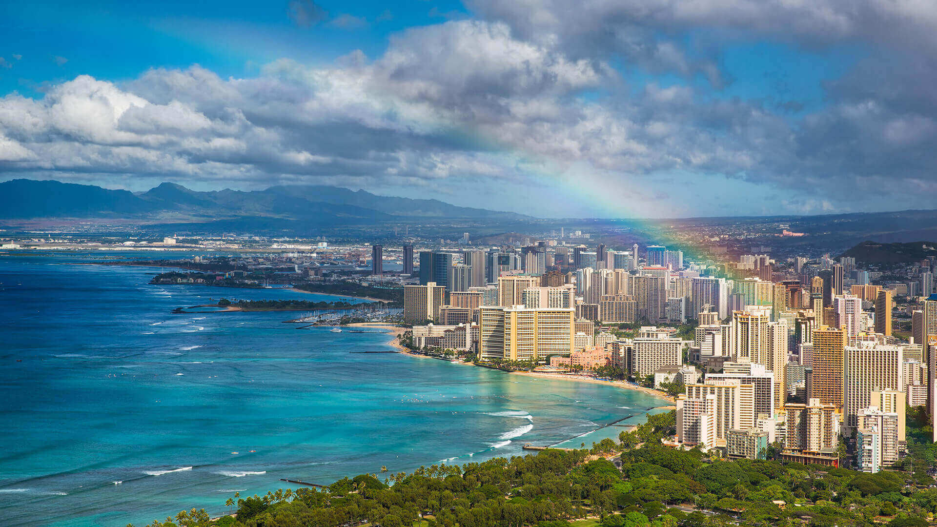 Waikiki Beach on Oahu Hawaii with Rainbow in the sky